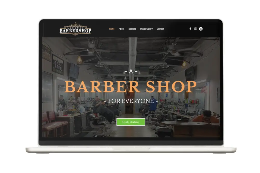 Laptop displaying a barber shop website redesign.